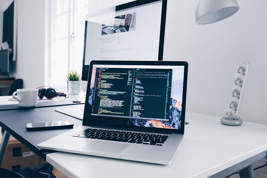 A laptop with code on a clean desk
