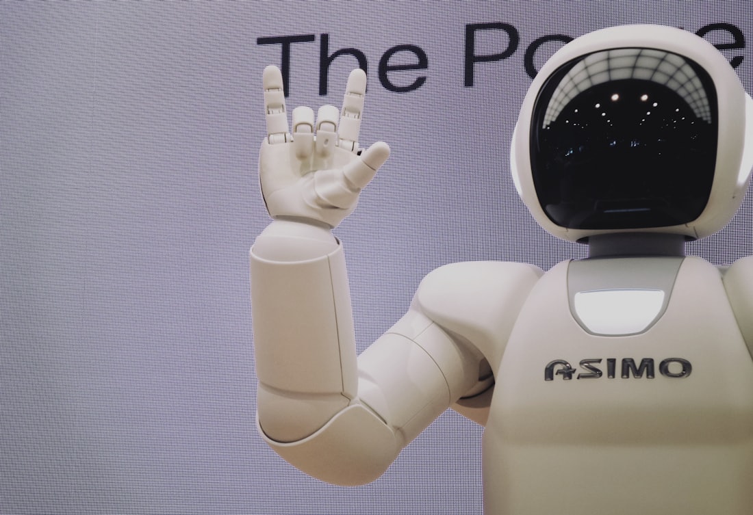 A white robot hand reaching upward